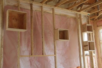 These boxes will be recessed into the rock, and will eventually become candle niches in the fireplace. 