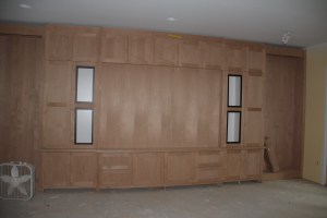 The basement cabinets.  The white rectangles are where speakers and speaker cloth will be.  The empty spaces on either end will be bookshelves.