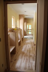 The front corridor from the laundry to the entry -- the basement stairs are in the background.