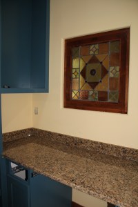 My desk, with the treasures stained glass window