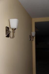 Wall sconces in basement hallway